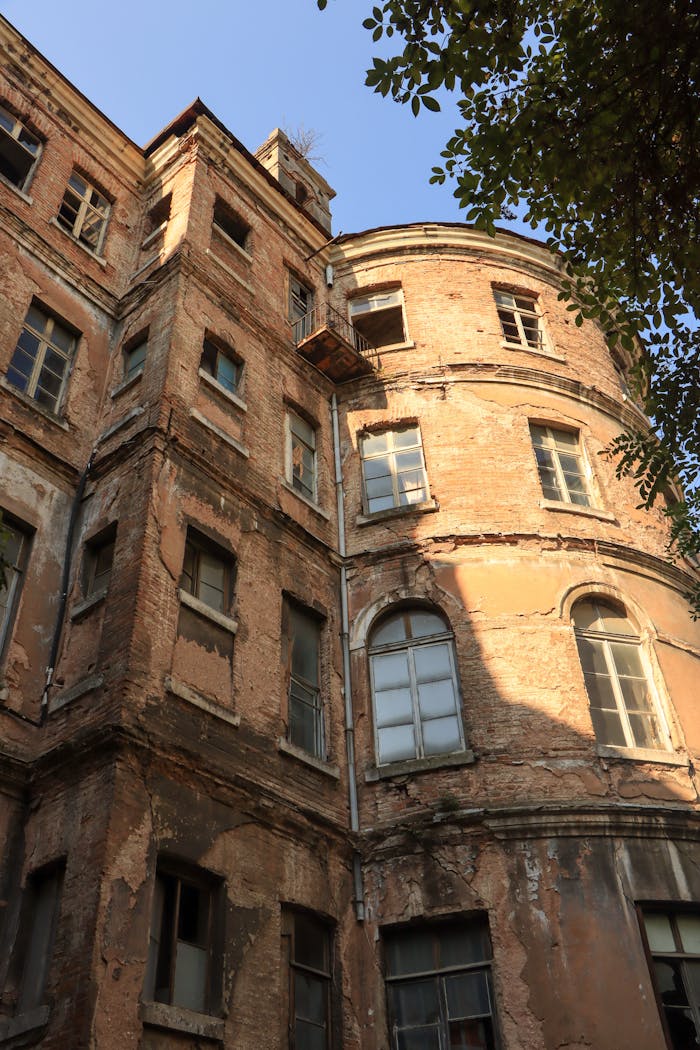 Low angle view of a historic French orphanage facade in Istanbul, Turkey.